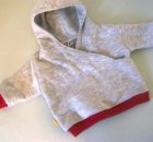 Sew Modern Kids are very pleased to bring you a FREE pattern for a lapped front hoodie for infants 0-3 months old. This really is the sweetest little sweatshirt. You will absolutely love this sweatshirt for a newborn. The lapped front, allows you to pull the sweatshirt off an on with ease. No zippers, no buttons, no snaps. Easy on, easy off, and a relatively happy baby (what baby really loves having their clothes changed). 