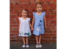 Here's a pattern for a very cute but simple A-line girl's dress which features frills at the shoulders and a loop and button back opening. What really makes this dress adorable are the wonderful appliques. The sewing pattern comes in sizes 1-7