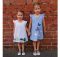 Here's a pattern for a very cute but simple A-line girl's dress which features frills at the shoulders and a loop and button back opening. What really makes this dress adorable are the wonderful appliques. The sewing pattern comes in sizes 1-7