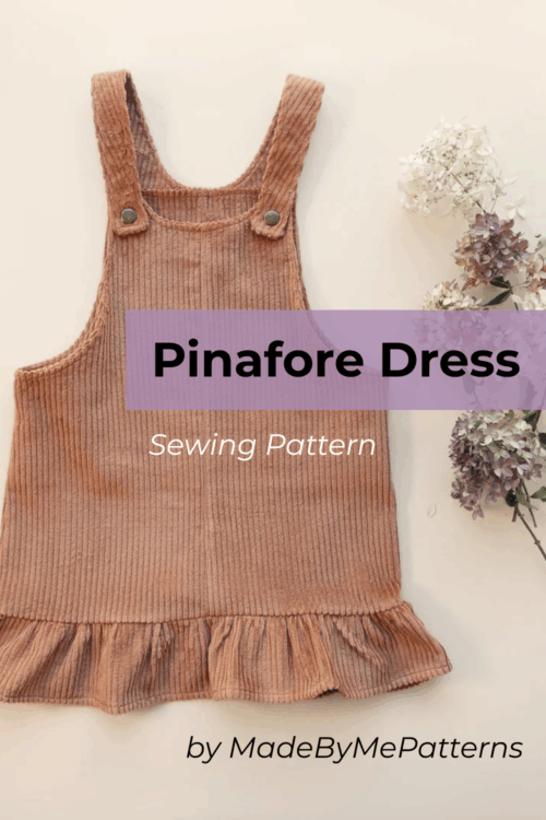 The Pinafore Dress Sewing Pattern by MadeByMePatterns front view laying flat